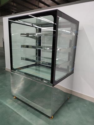 De Vertoningsmerchandiser van het douanegebakje met 3PCS op Glasplanken